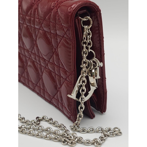 206 - A Christian Dior Red 'Lady Dior' Bag. Cannage quilted patent leather exterior. Magnetic closure, sil... 