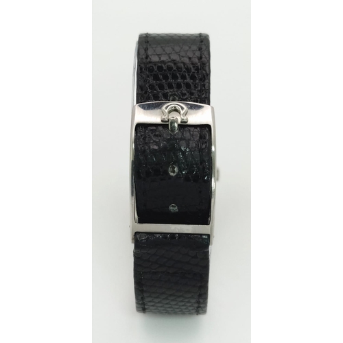 237 - A Classic Vintage Omega Geneve Quartz Watch. Black leather strap. Stainless steel rectangular case -... 