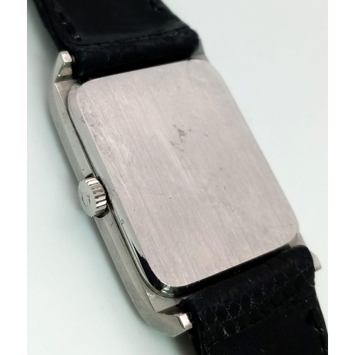 237 - A Classic Vintage Omega Geneve Quartz Watch. Black leather strap. Stainless steel rectangular case -... 