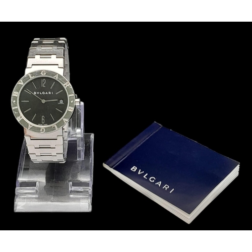 359 - A Bulgari BB33 Quartz Gents Watch. Stainless steel bracelet and case - 33mm. Black dial with date wi... 