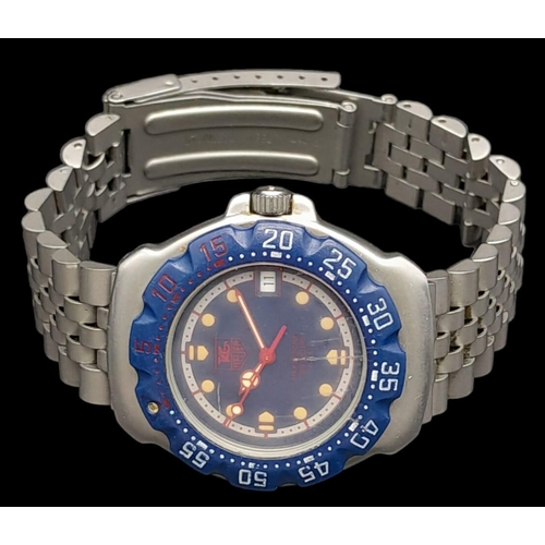 380 - A Tag Heuer Professional 200 Metres Quartz Watch. Titanium strap and case - 35mm. Blue dial with dat... 