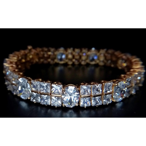 449 - A glamorous 9 K yellow gold bracelet with princess cut and oval cut cubic zirconia. Length: 17.5 c,.... 