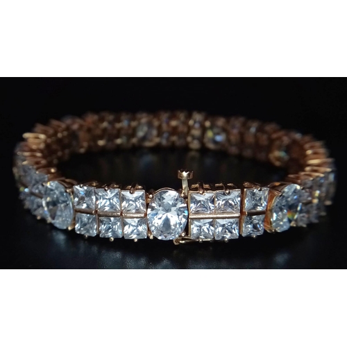 449 - A glamorous 9 K yellow gold bracelet with princess cut and oval cut cubic zirconia. Length: 17.5 c,.... 