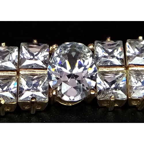 449 - A glamorous 9 K yellow gold bracelet with princess cut and oval cut cubic zirconia. Length: 17.5 c,.... 