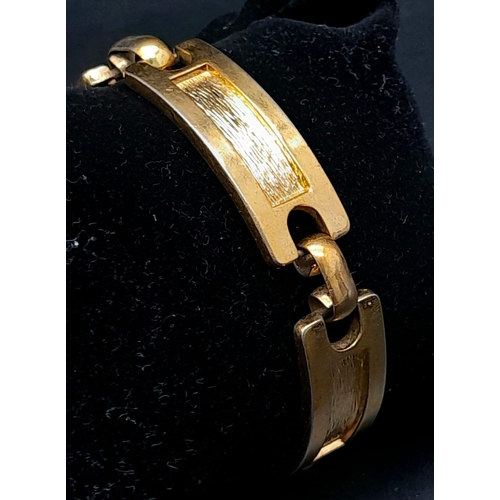 576 - A Designer Christian Dior Gilded Bar Bracelet. Comes with original Dior packaging. Ref: 14330