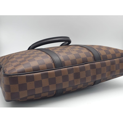 71 - A Louis Vuitton Damier Business Bag. Damier ebene leather exterior. Rolled leather handles and trim.... 