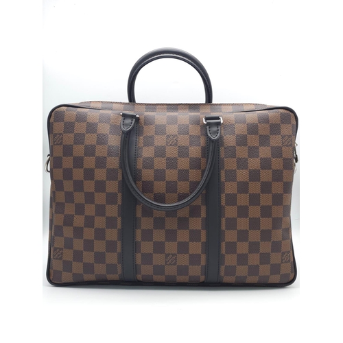 71 - A Louis Vuitton Damier Business Bag. Damier ebene leather exterior. Rolled leather handles and trim.... 