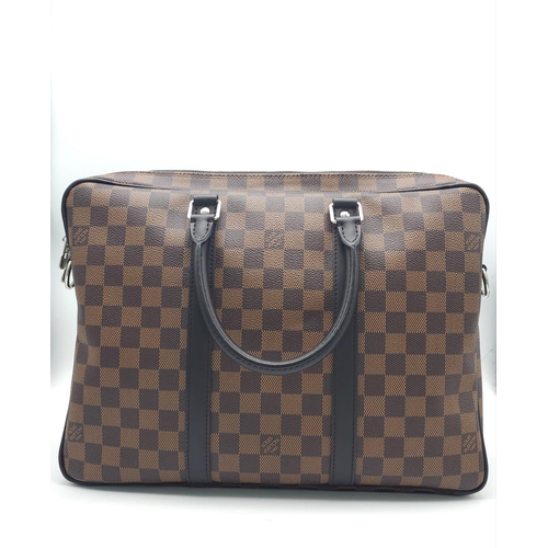 71 - A Louis Vuitton Damier Business Bag. Damier ebene leather exterior. Rolled leather handles and trim.... 