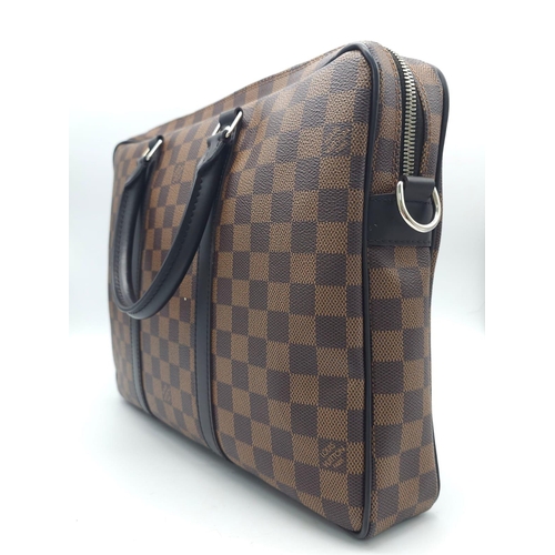 71 - A Louis Vuitton Damier Business Bag. Damier ebene leather exterior. Rolled leather handles and trim.... 