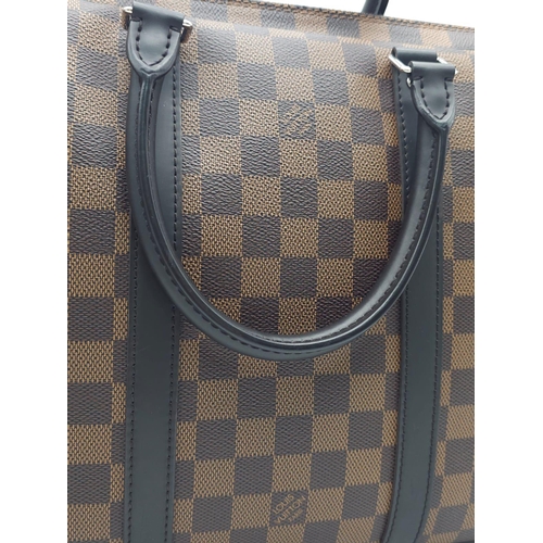 71 - A Louis Vuitton Damier Business Bag. Damier ebene leather exterior. Rolled leather handles and trim.... 