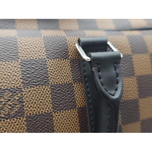 71 - A Louis Vuitton Damier Business Bag. Damier ebene leather exterior. Rolled leather handles and trim.... 