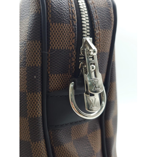 71 - A Louis Vuitton Damier Business Bag. Damier ebene leather exterior. Rolled leather handles and trim.... 