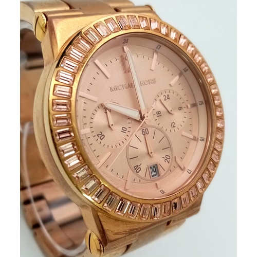 711 - A MICHAEL KORS ROSE GOLD COLOURED CHRONOGRAPH WATCH WITH 3 SUBDIALS ON STAINLESS STEEL