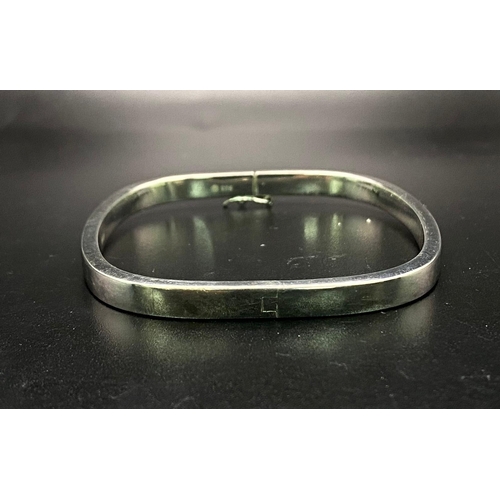 718 - A SOLID SILVER RECTANGULAR BANGLE  10.4gms