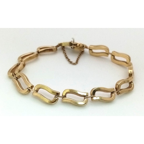 16 - A VERY ATTRACTIVE ITALIAN DESIGNER  9K GOLD BRACELET WITH SAFETY CHAIN .  11.3gms