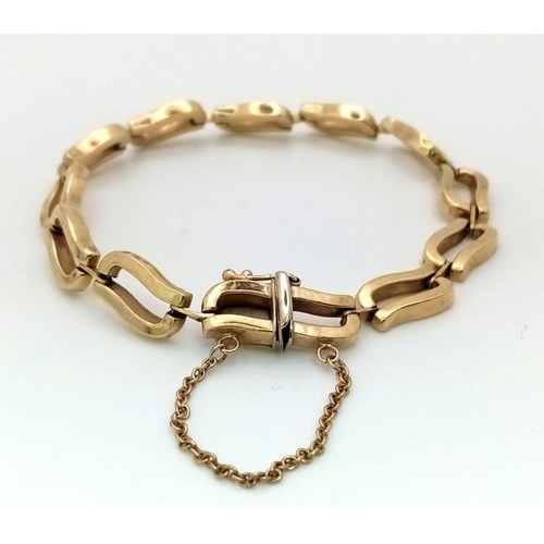 16 - A VERY ATTRACTIVE ITALIAN DESIGNER  9K GOLD BRACELET WITH SAFETY CHAIN .  11.3gms