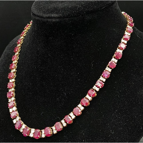 53 - A vintage, 9 K yellow gold necklace loaded with oval cut natural rubies and round cut diamonds. Leng... 