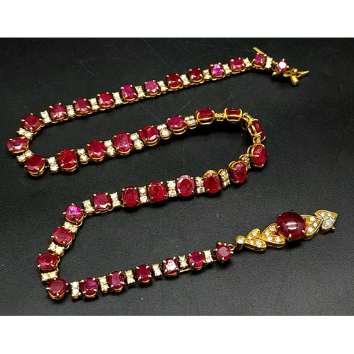 53 - A vintage, 9 K yellow gold necklace loaded with oval cut natural rubies and round cut diamonds. Leng... 