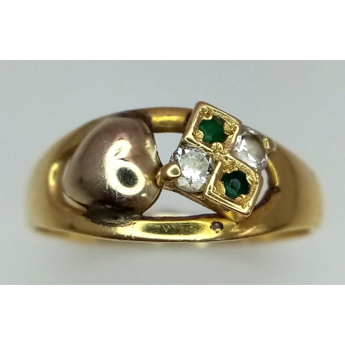 64 - An 18K Yellow Gold, Diamond and Emerald Ring. Four stone and heart decoration. Size N. 2.68g total w... 