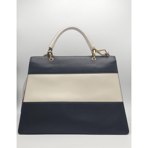 669 - A GUCCI Large QUEEN MARGARET TOP HANDLE BAG in Black with a beige strip across the front. The bag ha... 