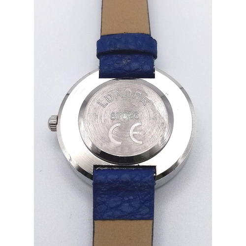 1160 - An Unworn French Ladies Round Face, Stone Set Blue Dial Quartz Watch by Ldadpr Paris. Full Working O... 