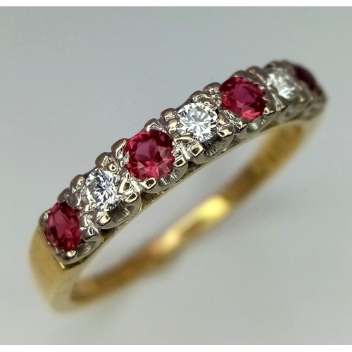 234 - An 18K Gold Ruby and Diamond Seven-Stone Ring. Three brilliant round cut diamonds with ruby neighbou... 