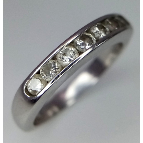 262 - An 18K White Gold Seven Stone Diamond Ring. Seven round cut diamonds. Size L. 4.2g total weight.