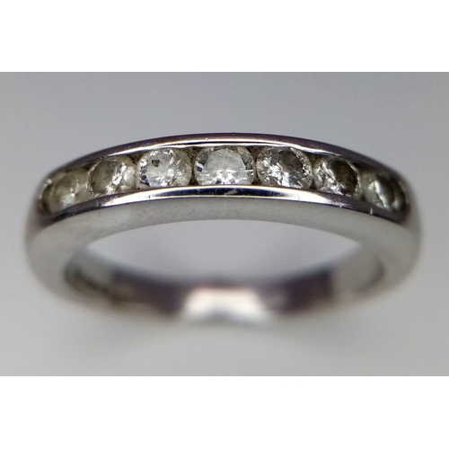 262 - An 18K White Gold Seven Stone Diamond Ring. Seven round cut diamonds. Size L. 4.2g total weight.