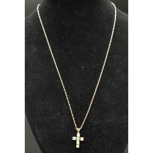 508 - A 9 Carat Gold Opal Set Cross Pendant Necklace 46cm Length. Cross Measures 2cm Length and is set wit... 