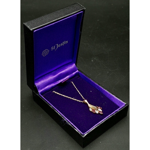 570 - A Fully Hallmarked 9 Carat Yellow Gold Diamond and Ruby Set Pendant Necklace 50cm Length chain. Pend... 