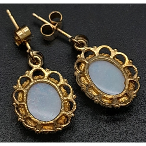 661 - Vintage or Antique 9 Carat Gold Opal Set Filigree Design Earrings 1.8cm Drop. 1.86 Grams Gross.