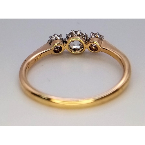 744 - A Vintage 18K Yellow Gold Diamond Ring. Three quality brilliant cut round diamonds. Size O. 2.3g tot... 