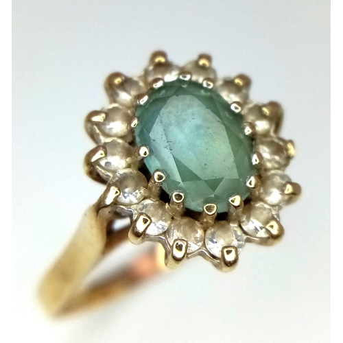 747 - A Vintage 9K Yellow Gold Aquamarine and White Stone Ring. 
Size P. 3.1g total weight.