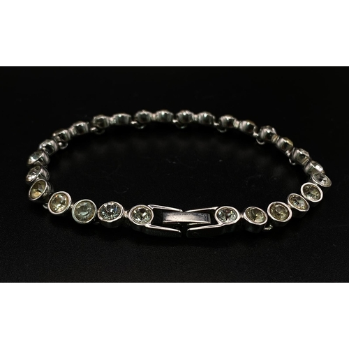 821 - An Ex Display Swarovski Crystal Set Tennis Bracelet. 17cm Length. Set with 4mm Round Cut Pale Yellow... 