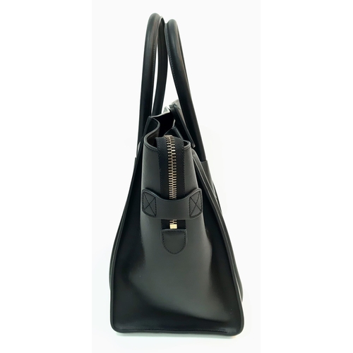 116 - Celine Black Luggage Handbag.
Quality leather interior/exterior. Design offers ample space for all y... 