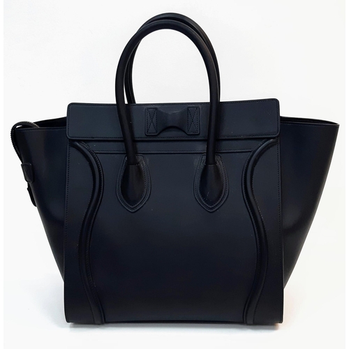 116 - Celine Black Luggage Handbag.
Quality leather interior/exterior. Design offers ample space for all y... 