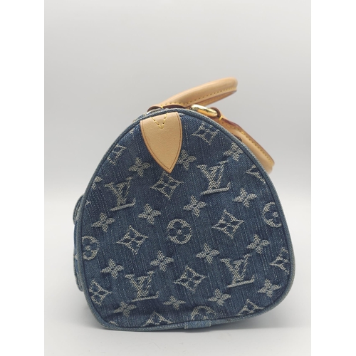 130 - 2005 Neo Speedy Louis Vuitton.
Indigo blue denim canvas/leather 2005 Neo Speedy bag from Louis Vuitt... 