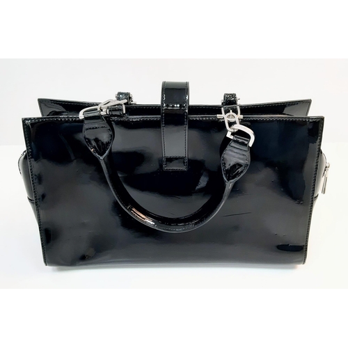 654 - An L.K. Bennett Black Patent Leather Twin Handle Zip Bag. Complete with Dust Cover. 34x12x21cm.