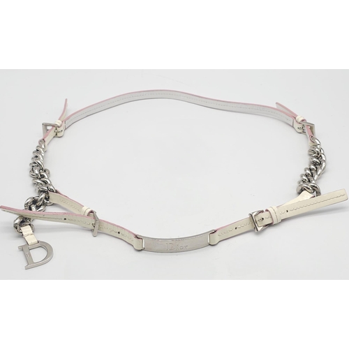 857 - Christian Dior White Leather & Chain Belt.
This stylish CD belt features pink highlights on white le... 