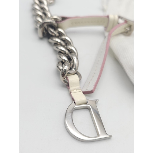 857 - Christian Dior White Leather & Chain Belt.
This stylish CD belt features pink highlights on white le... 