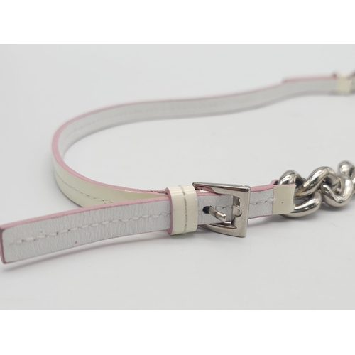 857 - Christian Dior White Leather & Chain Belt.
This stylish CD belt features pink highlights on white le... 