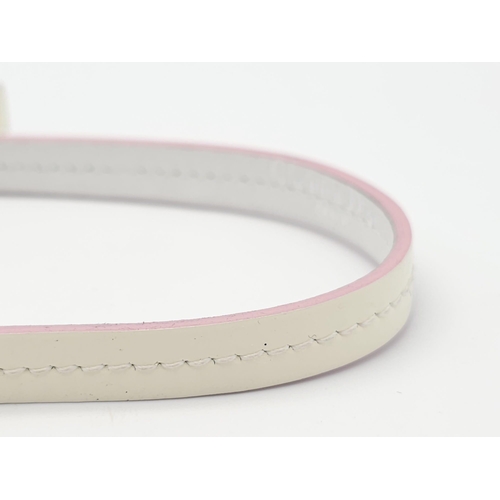 857 - Christian Dior White Leather & Chain Belt.
This stylish CD belt features pink highlights on white le... 