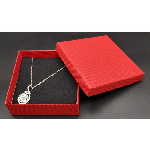 974 - An Exquisite New Clear Stone Set Pendant Necklace 52cm Length. Pendant measures 2.8cm Length. In Pre... 