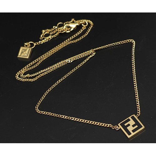 548 - A Designer Fendi Accessory Set. Includes: Bangle, necklace, ring and earring set. All are gold plate... 