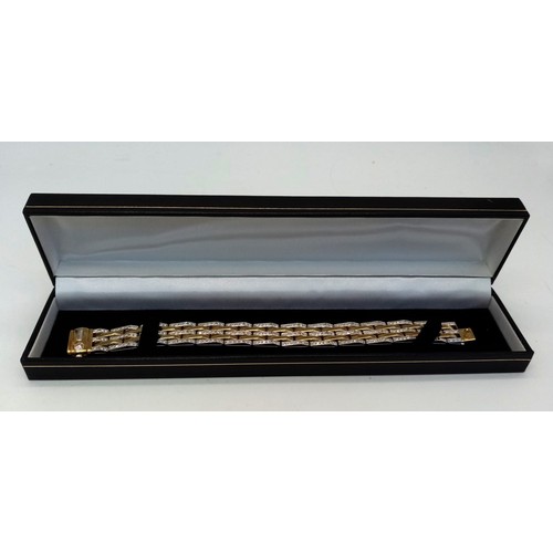 142 - A Beautiful Italian Designed Chimento 18K Gold and Diamond Bar Bracelet. Three rows of diamond bars ... 