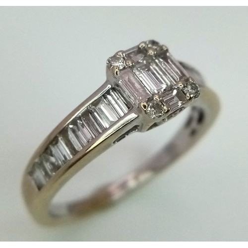 193 - An 18 K white gold ring with numerous baguette cut and four round cut diamonds (total 0.85 carats). ... 