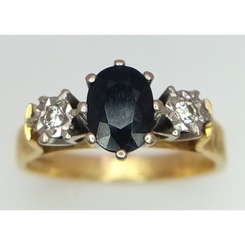 214 - An 18k yellow gold diamond and sapphire ring. 4.9g total weight. Size Q (sapp:1ct/dia:0.06ct).