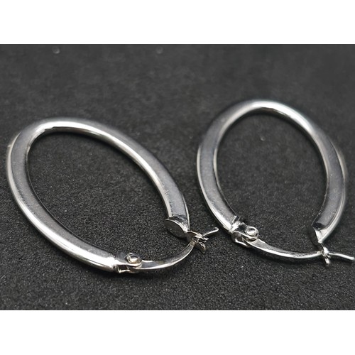 991 - 9kt White Gold Hoop Earrings.
New and Unworn.
W: 1.3g