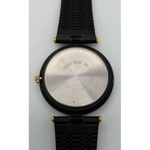 361 - A Dunhill Quartz Mid-Size Watch. Black metal strap and case - 32mm. White dial with roman numerals. ... 