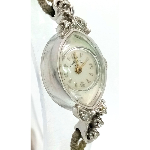 506 - A Vintage 14K White Gold and Diamond Lady Elgin Mechanical Cocktail Watch. Rope bracelet. 14k gold o... 